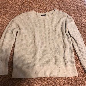 Blue, pink and purple tattered sweaters